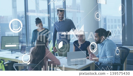 Presenting seated woman in business-casual leading data meeting in office with laptop and charts Presenting seated woman in business-casual leading data meeting in office with laptop and charts 139575430