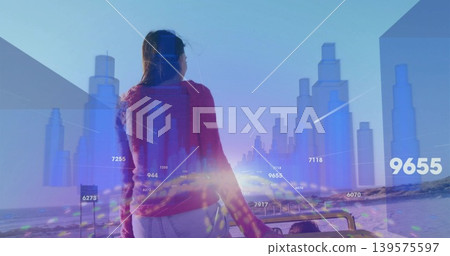 Standing woman in red sweater facing horizon at beach, with open-top jeep, holographic data overlay Standing woman in red sweater facing horizon at beach, with open-top jeep, holographic data overlay 139575597