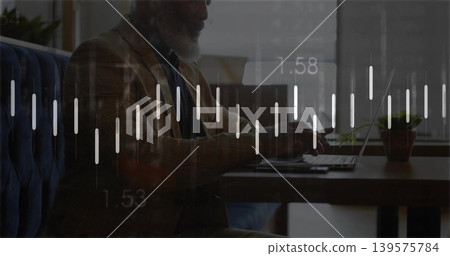 Working mature man in patterned blazer typing on laptop at cafe, with potted plant, data overlay Working mature man in patterned blazer typing on laptop at cafe, with potted plant, data overlay 139575784
