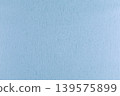 Light blue textured paper background 139575899