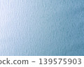 Light blue textured paper background 139575903