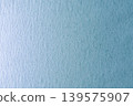 Light blue textured paper background 139575907
