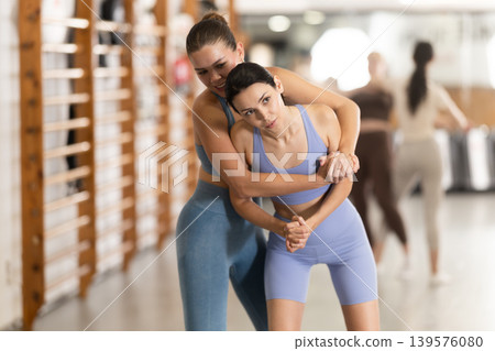 Young girl practicing self-defense techniques in pair 139576080