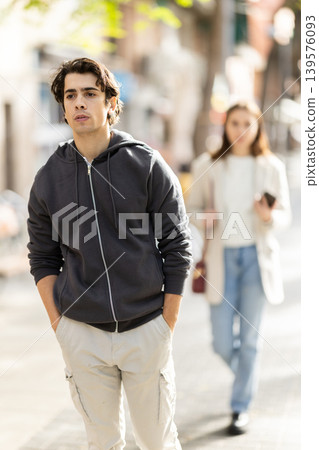 Quarrel between guy and girl during walk. 139576093