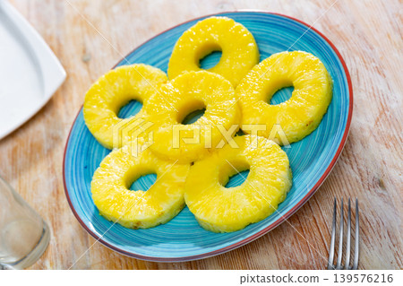 Sliced pineapple on plate 139576216