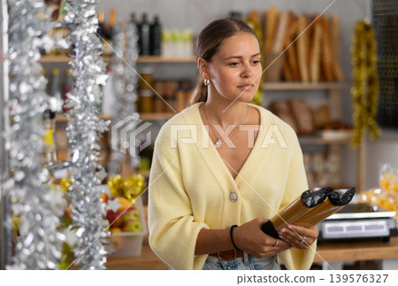 Young woman choosing pasta Young woman choosing pasta 139576327