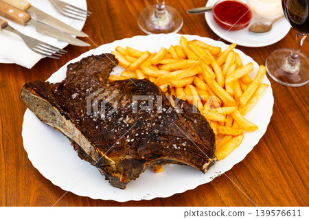 Appetizing beef entrecote with french fries Appetizing beef entrecote with french fries 139576611