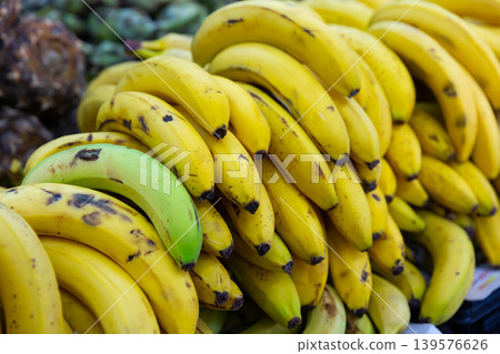 close up of mature bananas on counter in marketplace close up of mature bananas on counter in marketplace 139576626