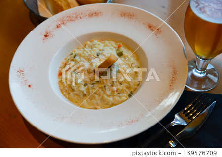 Chicken and vegetable risotto with 4 cheeses and Parmesan Chicken and vegetable risotto with 4 cheeses and Parmesan 139576709