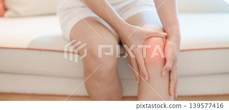 woman having knee ache and muscle pain due to Runners Knee or Patellofemoral Pain Syndrome, osteoarthritis, arthritis, rheumatism and Patellar Tendinitis. health and medical concept 139577416