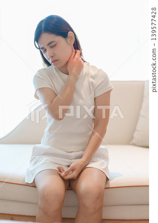 Woman having Neck pain for concepts of Neck Muscle Strain and Inflammation, Myofascial pain syndrome and Fibromyalgia, Rheumatism, Cervical Spine Spondylosis, Office Syndrome and Ergonomic Woman having Neck pain for concepts of Neck Muscle Strain and Inflammation, Myofascial pain syndrome and Fibromyalgia, Rheumatism, Cervical Spine Spondylosis, Office Syndrome and Ergonomic 139577428