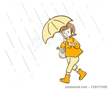 一位女士在狂風暴雨中撐著傘。 一位女士在狂風暴雨中撐著傘。 139577495