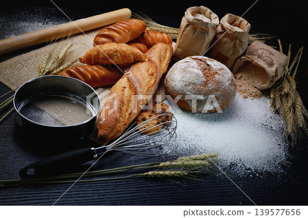 many type of bread studio shot with ingredients flour seed grain all aroundphoto take with high iso may has some noise and gain.many type of bread studio shot with ingredients flour seed grain many type of bread studio shot with ingredients flour seed grain all aroundphoto take with high iso may has some noise and gain.many type of bread studio shot with ingredients flour seed grain 139577656