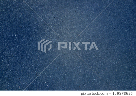 Blue textured abstract background with subtle sparkle Blue textured abstract background with subtle sparkle 139578655