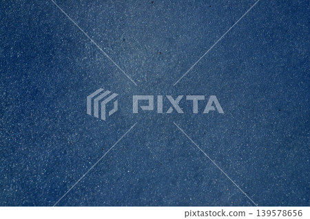 Blue textured abstract background with subtle sparkle Blue textured abstract background with subtle sparkle 139578656