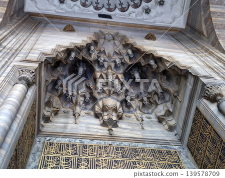 Ornate carved stone architectural detail with Arabic calligraphy Ornate carved stone architectural detail with Arabic calligraphy 139578709