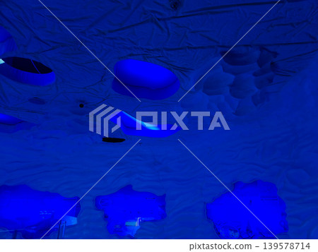 Blue illuminated abstract ceiling interior Blue illuminated abstract ceiling interior 139578714