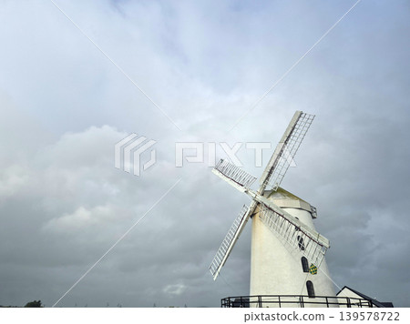 Historic windmill under dramatic cloudy sky Historic windmill under dramatic cloudy sky 139578722