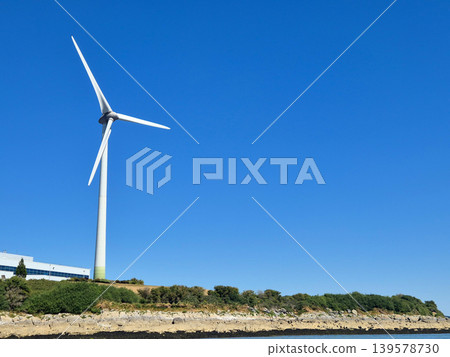Wind turbine against clear blue sky Wind turbine against clear blue sky 139578730