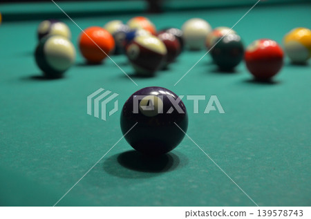 Number Four Billiard Ball on Pool Table Number Four Billiard Ball on Pool Table 139578743