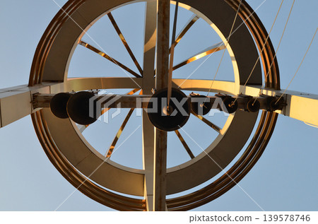 Modern metal sculpture against clear blue sky Modern metal sculpture against clear blue sky 139578746