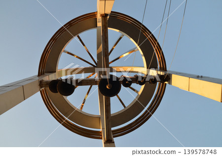 Modern metal sculpture against clear blue sky Modern metal sculpture against clear blue sky 139578748