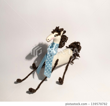Handmade fabric horse toy with blue ribbon Handmade fabric horse toy with blue ribbon 139578782