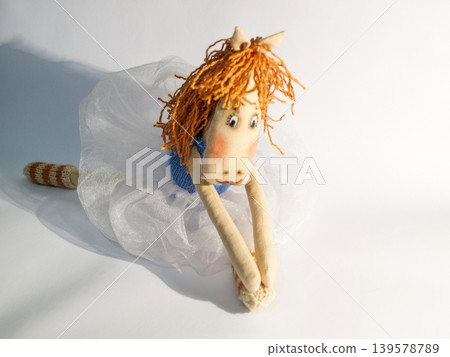 Handmade fabric horse toy on white background Handmade fabric horse toy on white background 139578789