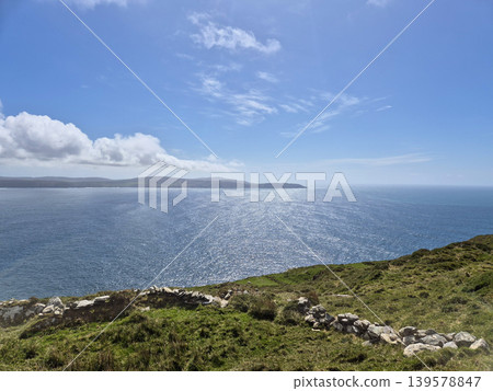 Sunny coastal landscape with ocean and distant horizon Sunny coastal landscape with ocean and distant horizon 139578847
