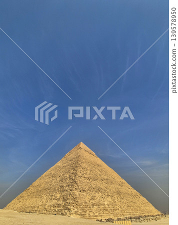 Ancient stone pyramid under clear blue sky 139578950