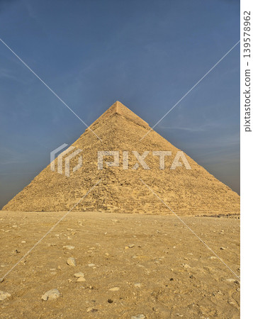 Ancient stone pyramid under clear blue sky Ancient stone pyramid under clear blue sky 139578962