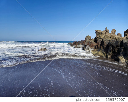 Waves Washing onto Black Sand and Rocks Waves Washing onto Black Sand and Rocks 139579007