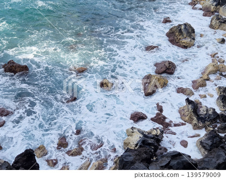 Waves Breaking Over Rocky Shoreline Waves Breaking Over Rocky Shoreline 139579009