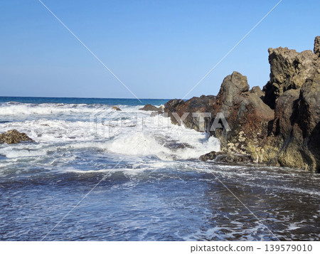 Waves Breaking Against Rocky Seashore 139579010