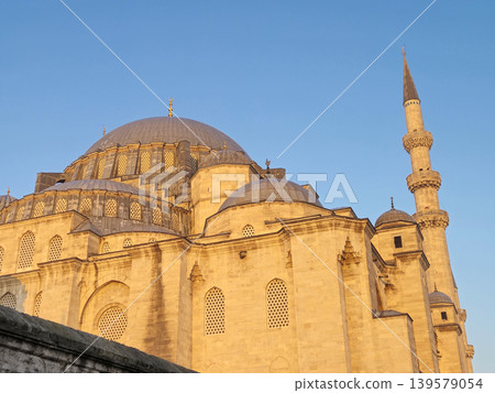 Historic mosque with dome and minaret at sunset Historic mosque with dome and minaret at sunset 139579054