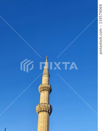 Tall minaret against clear blue sky Tall minaret against clear blue sky 139579069
