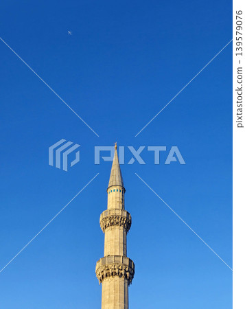Single minaret against clear blue sky Single minaret against clear blue sky 139579076