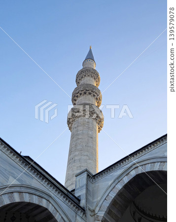Historic mosque minaret against clear blue sky Historic mosque minaret against clear blue sky 139579078