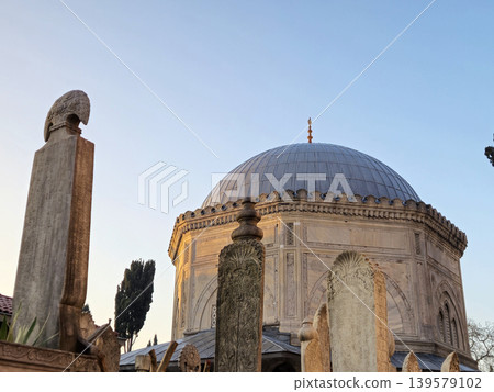 Historic domed mausoleum with ornate stone markers Historic domed mausoleum with ornate stone markers 139579102