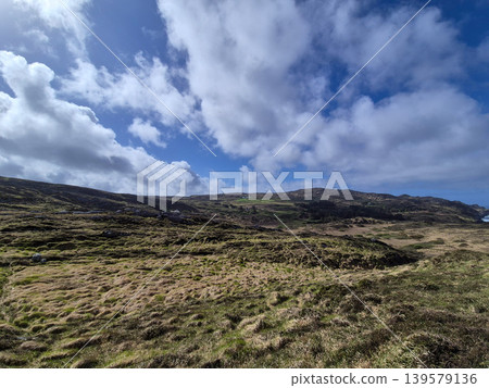 Mossy Hills Under Dramatic Cloudy Sky Mossy Hills Under Dramatic Cloudy Sky 139579136