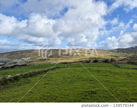 Green countryside hills beneath a dramatic cloudy sky 139579144