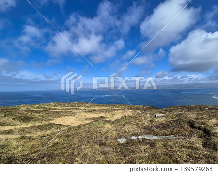Scenic coastal landscape with ocean and dramatic clouds Scenic coastal landscape with ocean and dramatic clouds 139579263