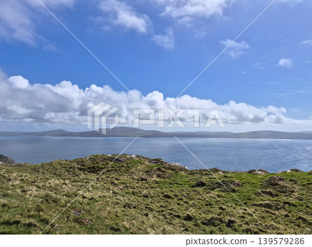 Coastal landscape with blue sea and cloudy sky 139579286