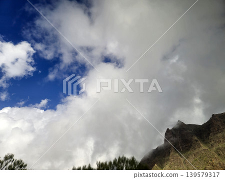 Dramatic clouds over mountain ridge Dramatic clouds over mountain ridge 139579317