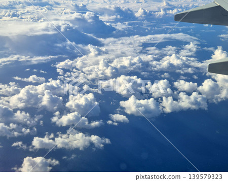Aerial View of Clouds from Airplane Window 139579323