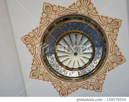 Decorative ceiling medallion with ornate circular design Decorative ceiling medallion with ornate circular design 139579354