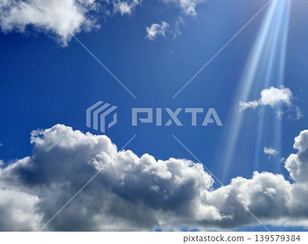 Blue Sky with Dramatic Sunlight and Clouds 139579384