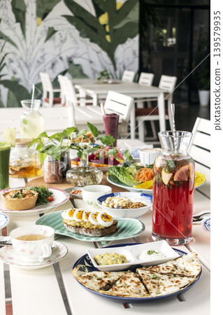 mixed western healthy food meal on restaurant table outdoors in singapore restaurant mixed western healthy food meal on restaurant table outdoors in singapore restaurant 139579935