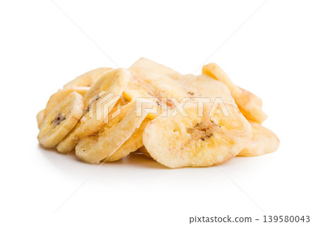 Crispy Banana Chips Pile Dried Banana Snack Slices Close-Up on White Background 139580043
