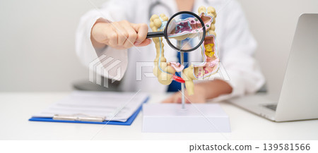Doctor with human Colon anatomy model. Colonic disease, Large Intestine, Colorectal cancer, Ulcerative colitis, Diverticulitis, Irritable bowel syndrome, Digestive system and Healthcare concept 139581566